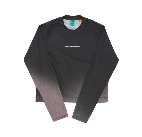 Women's long sleeve Running T-Shirt in Black/Grey with raglan sleeves. It features a gradient sublimation print shifting to a lighter shade at the bottom. Made from quick-drying, post-consumer recycled polyester with 4-way stretch for great flexibility, ventilation, and breathability. The UNNA "Finish in a Good Place" manifesto is printed on the chest.