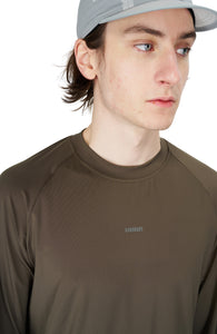 Regular fit raglan long sleeve running T-shirt in Wren Brown. Made in an Italian lightweight fabric with fast dry tech. Thumb holes on sleeves. Reflective print on the chest and lower back.