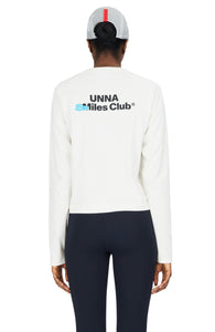 Women's long sleeve raglan T-shirt in Vanilla White with a regular fit and brushed finish. Thumb hole on sleeves. Organic Cotton and Recycled Polyester blend. Unna logo in the front and UNNA Smiles Club Print on the back.