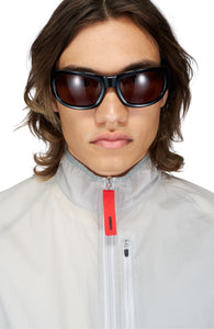 Half-way zipper with red UNNA patch and zippered chest pocket