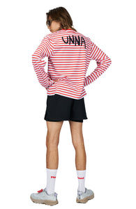A bold, hand-drawn UNNA text on the back