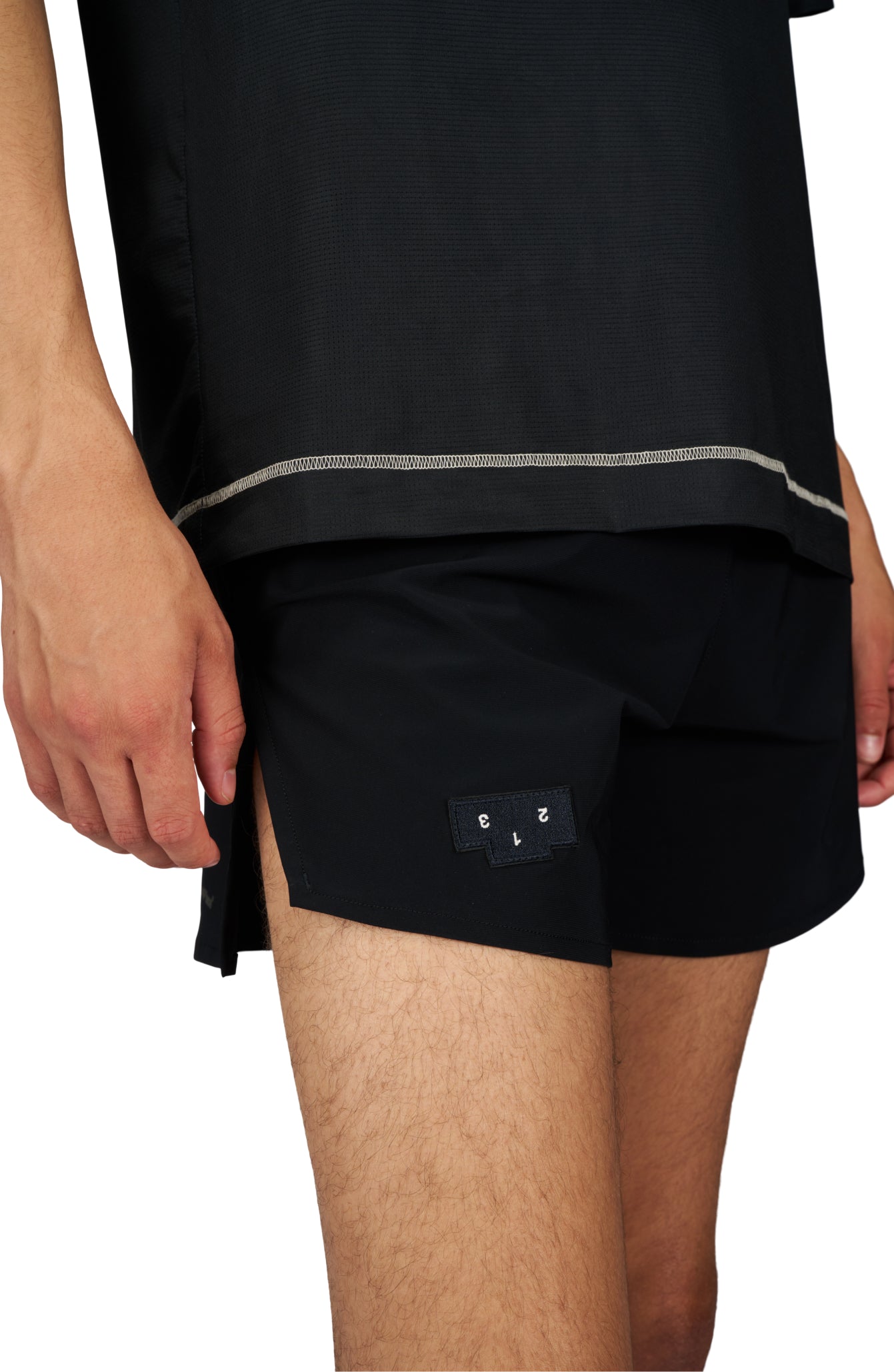 Men's running shorts in Black with a soft stretch and side vents. Podium Logo in the front and reflective 