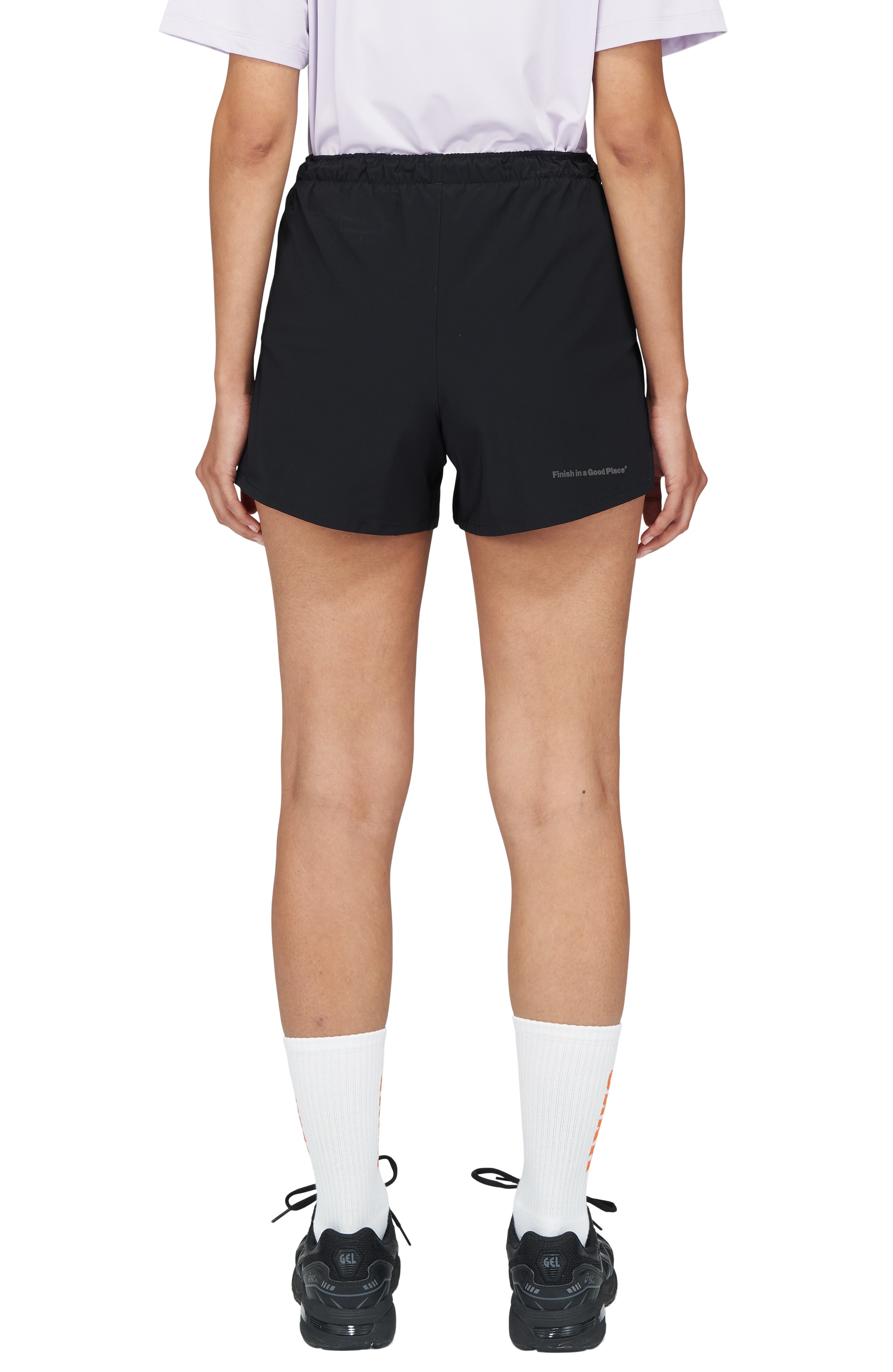 Women's running shorts in Black with a soft stretch and side vents. Podium Logo in the front and reflective 