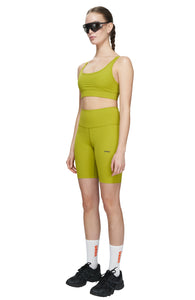 Bike shorts in Golden Green with a slight compression and smart pockets for your phone, airpods and what not. UNNA logo on the front leg and "Finish in a Good Place" on the back. Made in Econyl.