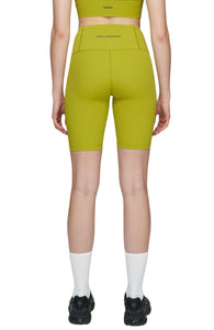 Bike shorts in Golden Green with a slight compression and smart pockets for your phone, airpods and what not. UNNA logo on the front leg and "Finish in a Good Place" on the back. Made in Econyl.