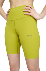 Bike shorts in Golden Green with a slight compression and smart pockets for your phone, airpods and what not. UNNA logo on the front leg and "Finish in a Good Place" on the back. Made in Econyl.