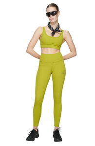 Light compression tights in Golden Green with smart pockets for your phone, airpods, and what not. UNNA logo on the front leg and "Finish in a Good Place" on the back. 