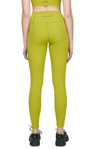 Light compression tights in Golden Green with smart pockets for your phone, airpods, and what not. UNNA logo on the front leg and "Finish in a Good Place" on the back. 