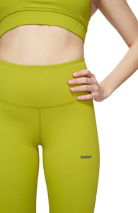 Light compression tights in Golden Green with smart pockets for your phone, airpods, and what not. UNNA logo on the front leg and "Finish in a Good Place" on the back. 