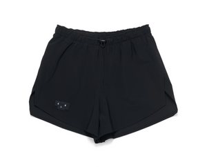 Women's running shorts in Black with a soft stretch and side vents. Podium Logo in the front and reflective 