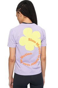 Screen printed t-shirt for women in lilac purple with print of flower with the text "Slow motion is better than no motion"